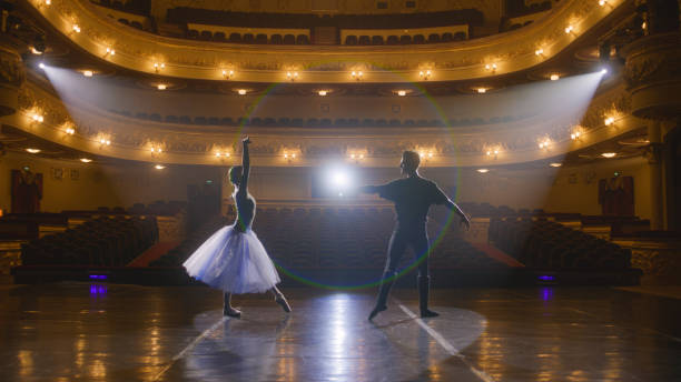 istock Classical ballet dancers practice on theatre stage 1483177369