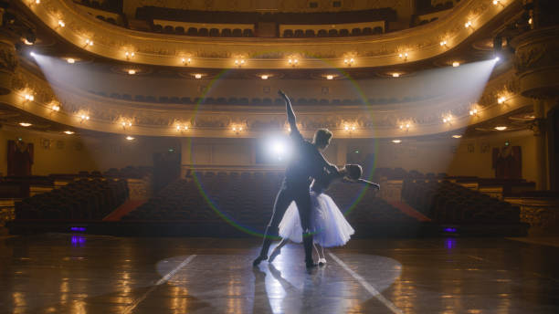 istock Classical ballet dancers practice on theatre stage 1483177395