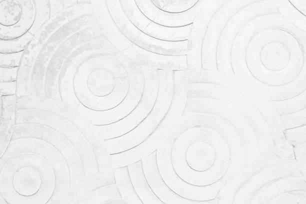 istock White concrete texture wall background. Abstract grey paint floor stamped concrete surface clean polished on walkway in garden. Wallpaper pattern curved circle rough gray cement stone decorative. 1483178818