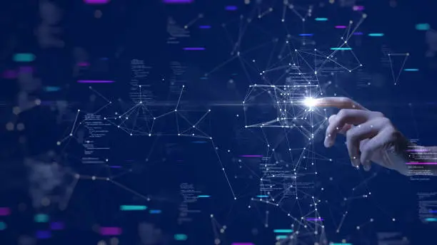 Photo of Digital cyber era technology concept. Human hand touching interconnected polygons of massive amounts of data glowing on a dark blue background. New innovations that are coming to change the world.
