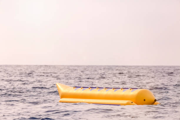 istock Empty yellow banana boat lying in the sea 1483182520