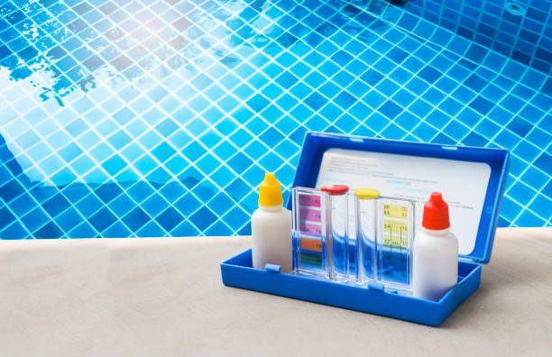 istock Water tester over clear swimming pool water 1483182530