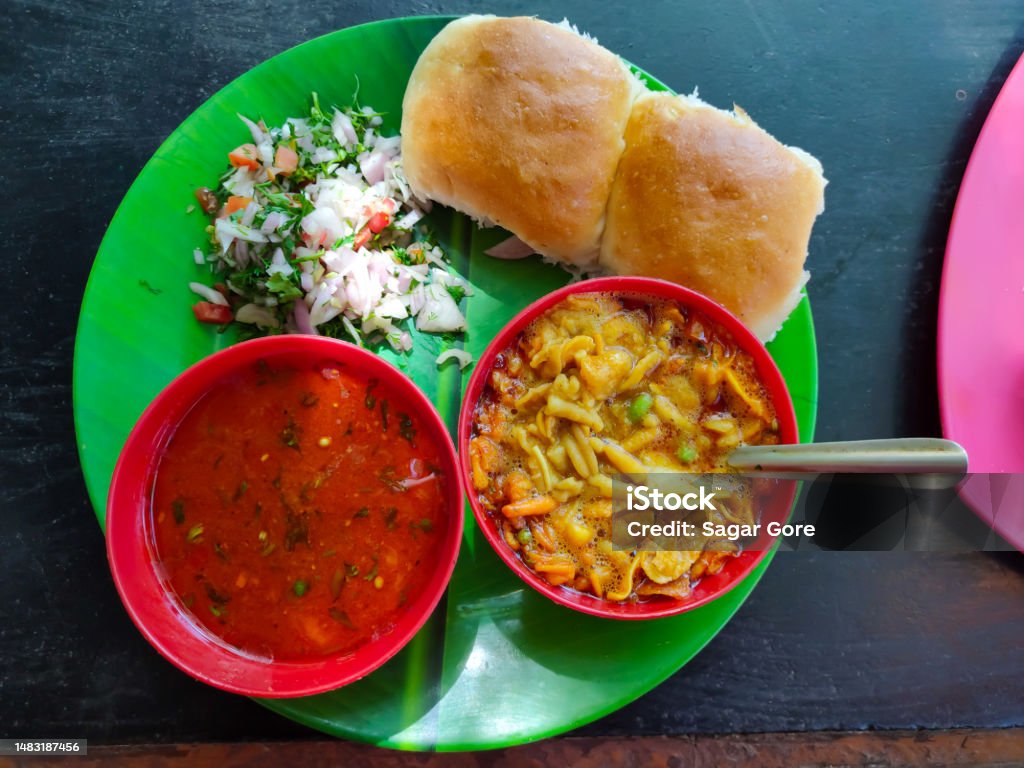 Spicy E.g. Pav or usal Pav Spicy Misal Pav or usal Pav is a traditional snack or Chaat food from Maharashtra, India. Served with chopped onion, lemon Bowl Stock Photo