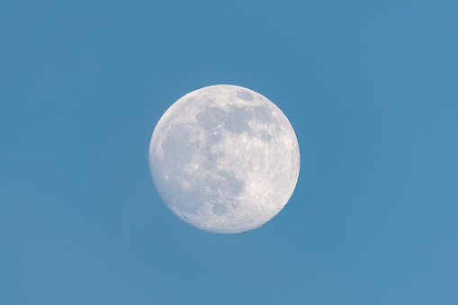 full moon on blue sky background