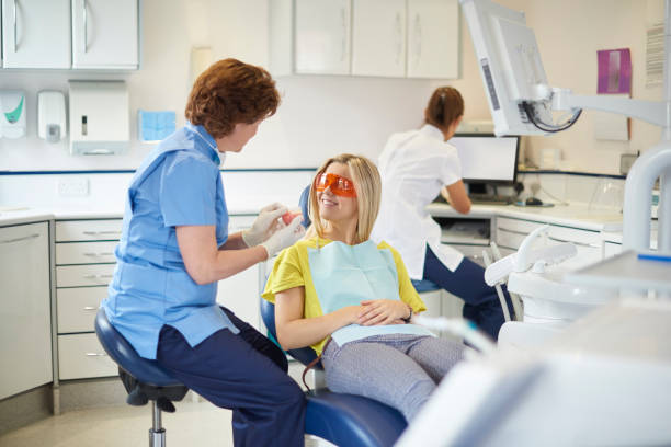 istock female dentist explaining the treatment to patient 1483189169