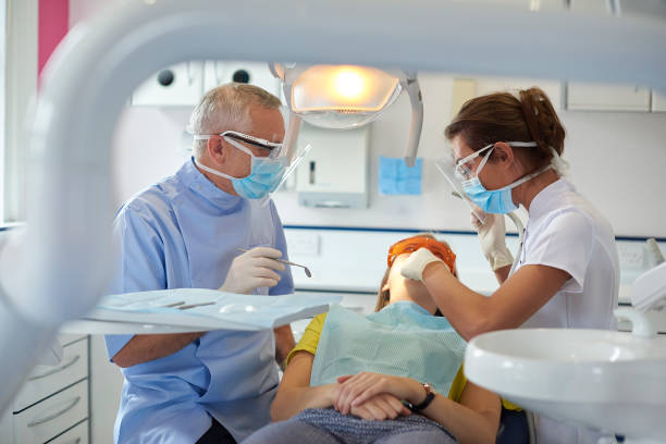 istock dental team patient check up 1483189212