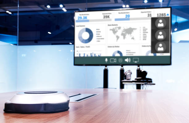 istock Wireless microphone portable on table with presentation on screen television in meeting room 1483193494