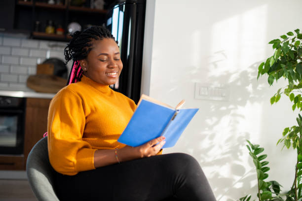 istock Woman relaxing and reading a book 1483197221