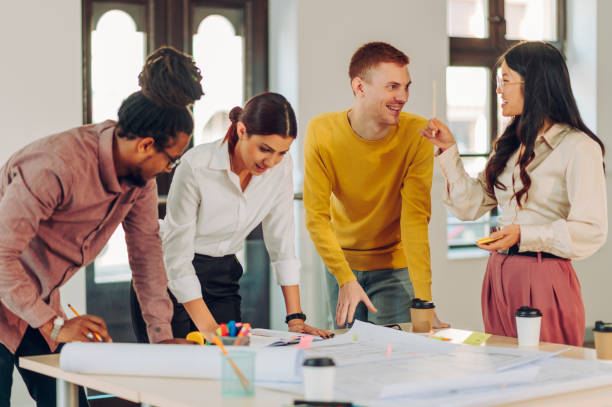 istock Diverse group of engineers or architects having a meeting in an office 1483199082
