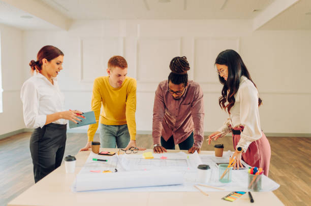istock Diverse group of engineers or architects having a meeting in an office 1483199109