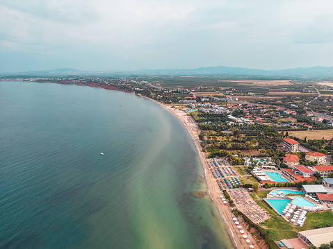 Lovely scenery at Greek coastline. Hude hotel resort with many pools.