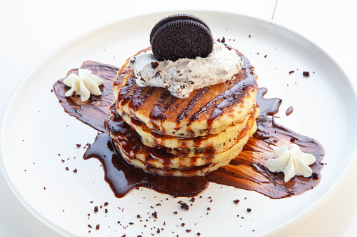 Chocolate pancakes with cookies and cream.