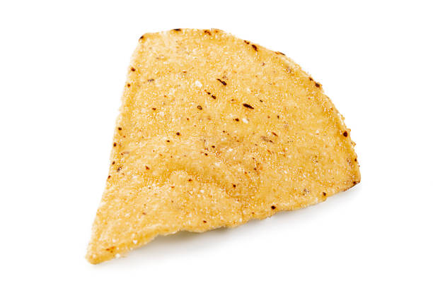 istock tortilla or nachos chips isolated on white background. corn tortilla or nachos chips isolated on white background. Crunchy tortilla or nachos chips isolated on white background 1483202298