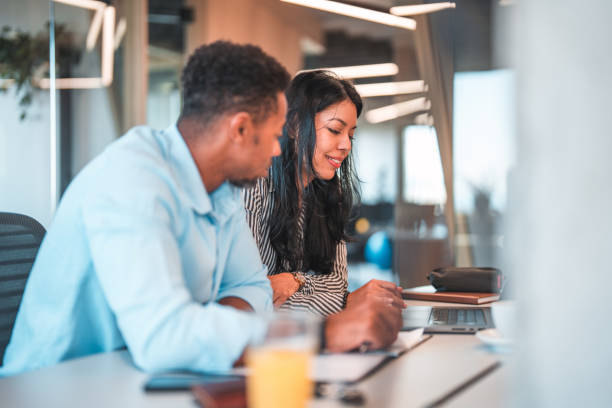 istock Male Intern Taking Notes from Female Manager 1483203163