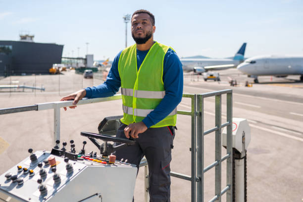 istock Airport Worker Driving A Cargo Loader On A Runway 1483204011