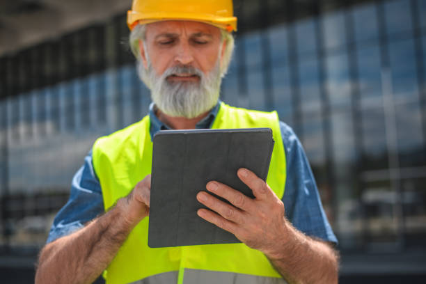 istock Mature White Male Engineer Working With A Digital Tablet In A Construction Site 1483204209