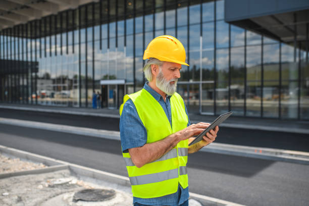 istock Handsome Mature Caucasian Male Architect Working Online While Supervising A Construction Project 1483204224