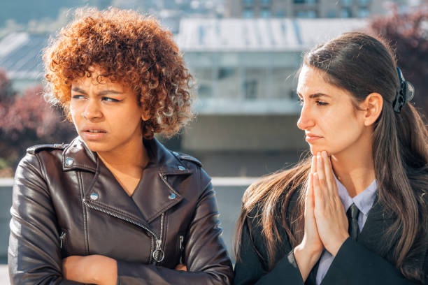 istock girl apologizing or sorry to her friend 1483206374
