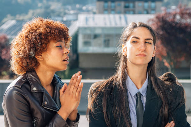 istock girl apologizing or sorry to her friend 1483206375