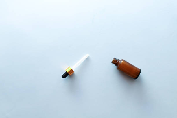 istock Massage oil on a blue background flat lay 1483208917