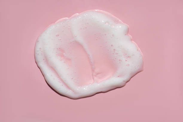 istock White lather foam moisturizer cleanser on pink 1483211541
