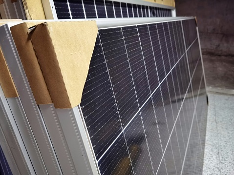 brand new solar panels stored in a warehouse