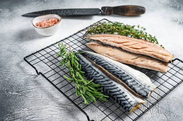 istock Fresh sliced mackerel fillet fish. White background. Top view 1483214333