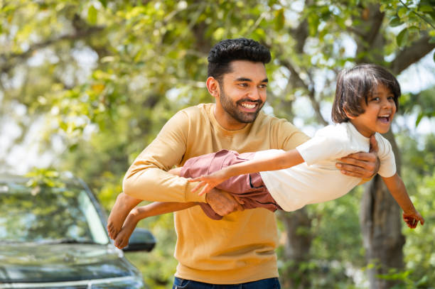 istock Happy young father playing by holding daughter while kid flying like a plane - concept of emotional well being, weekend travel and parenthood 1483218084