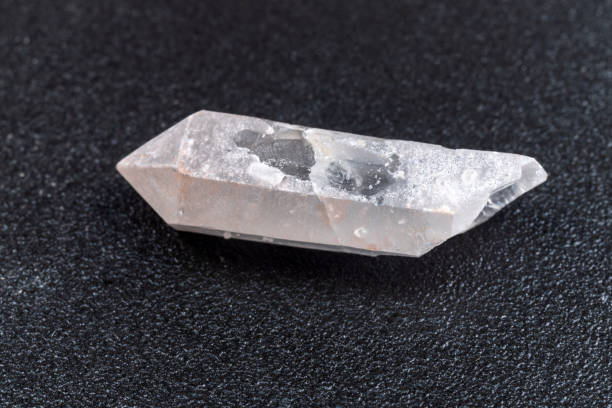 istock Geological collection mineral white rock crystal. Quartz Berg, black background 1483219354