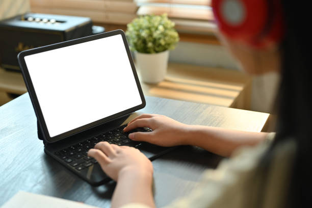 istock View over shoulder teenage girl studying online classes on digital tablet. Online learning, homeschooling concept. 1483219371