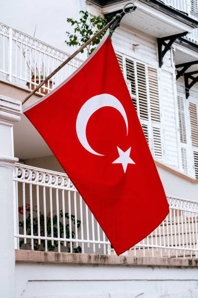 istock Big Turkish flag hanging on a old mansion facade. 1483220846