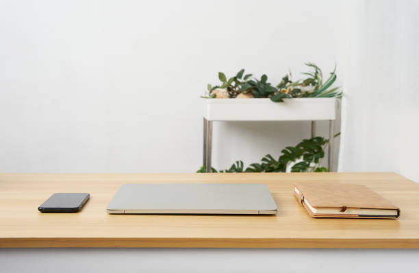 istock White office desk table with notebook and other office supplies background with copy space 1483221438