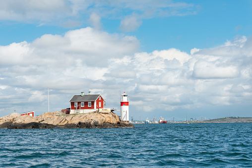 Lighthouse outside Gothenburg city, Sweden. City is visible in the background.