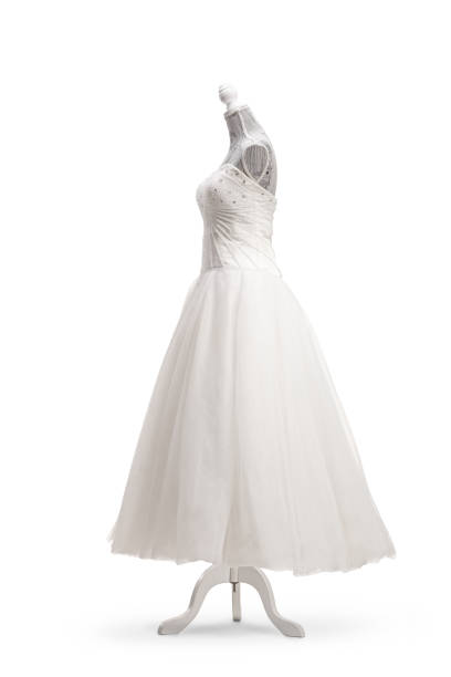 Side shot of a white wedding dress on a mannequin doll isolated on white background