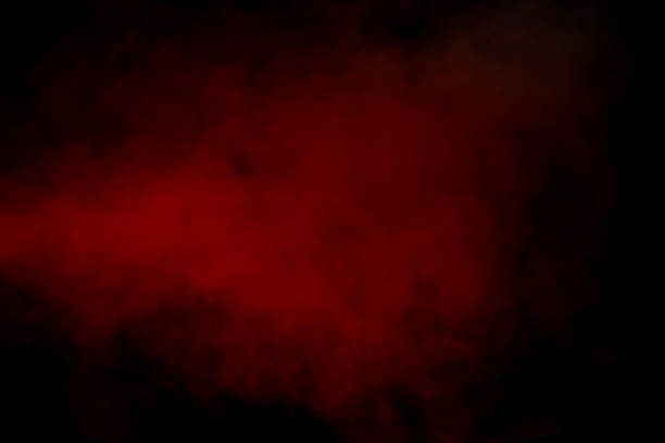 Orange and red steam on a black background. Copy space.
