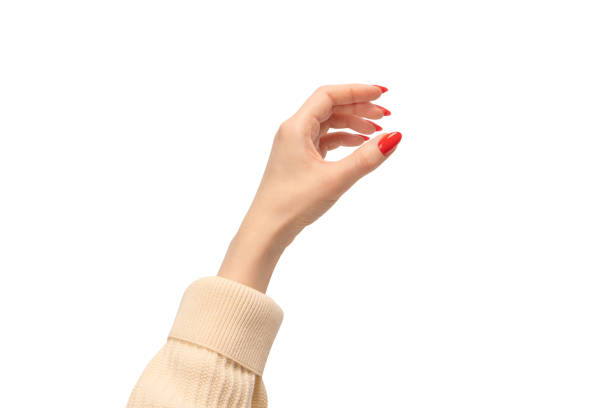 istock Woman hand with red nails holding something. 1483231639