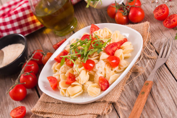 istock Orecchiette pasta with arugula and tomato. 1483231962