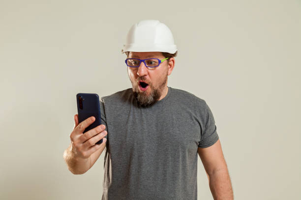 istock The guy shows talking on the phone 1483233193