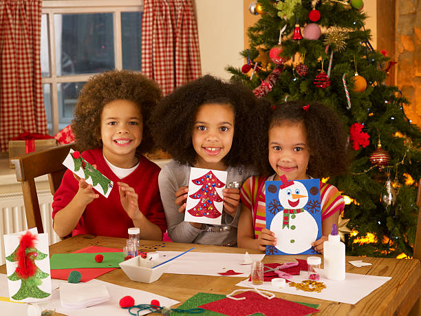 istock Mixed race children making Christmas cards 148323503