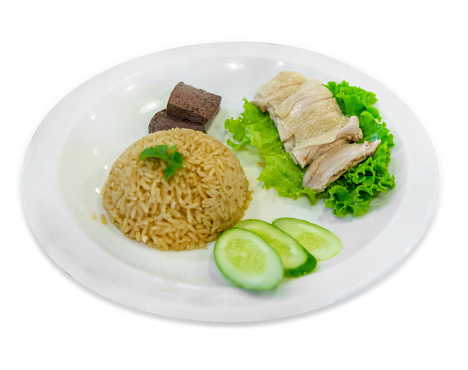 Die cut of Hainanese chicken rice or steamed chicken rice on white isolated.