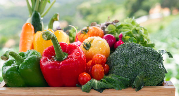 istock Wooden crate filled with fresh organic vegetables 1483238928