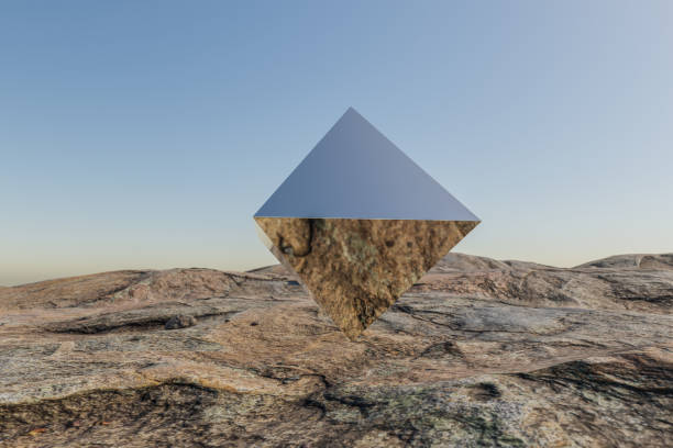 istock single metal prism pyramid cube hovering in the air in large empty desert environment; abstract surreal concept; 3D Illustration 1483239265