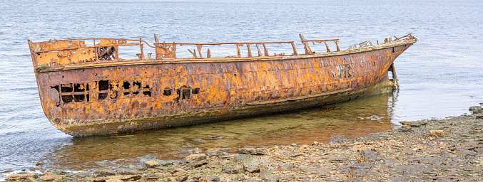 Patched stern of an old wooden fishing boat