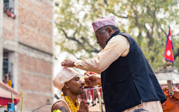 Nepalese devotee his tongue pierced with a metal needle during the celebration of Bisket Festival in Thimi, Bhaktapur,  Nepal, on  Saturday April 15, 2023