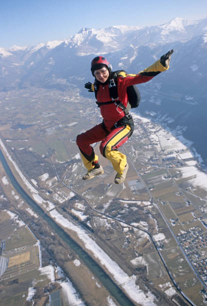 istock Skydiver in free fall above snowy fields and mountains 1483241642