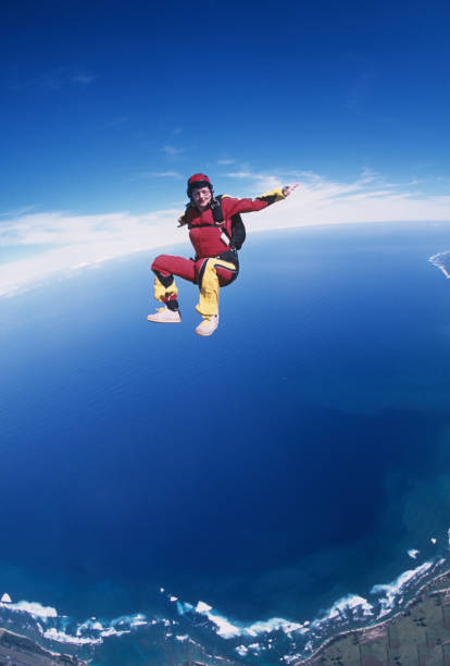 istock Skydiver in free fall above sea 1483241647