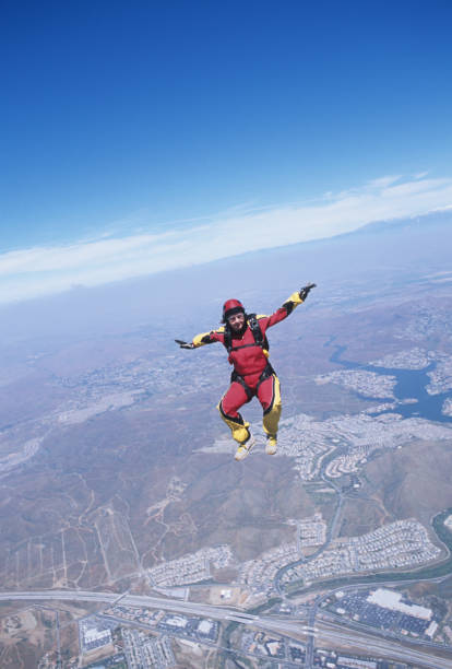 istock Skydiver in free fall above urban area 1483241691