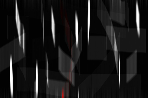 Blurry background in black with white beams and on red beam.