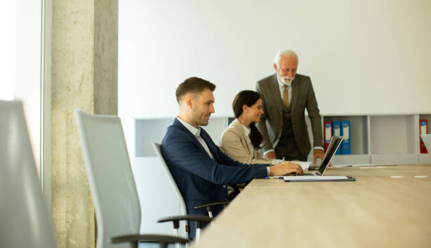 istock Young business man using laptop computer in the office 1483245243