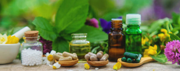 istock Homeopathy herbs and medicine pills. Selective focus. 1483245542